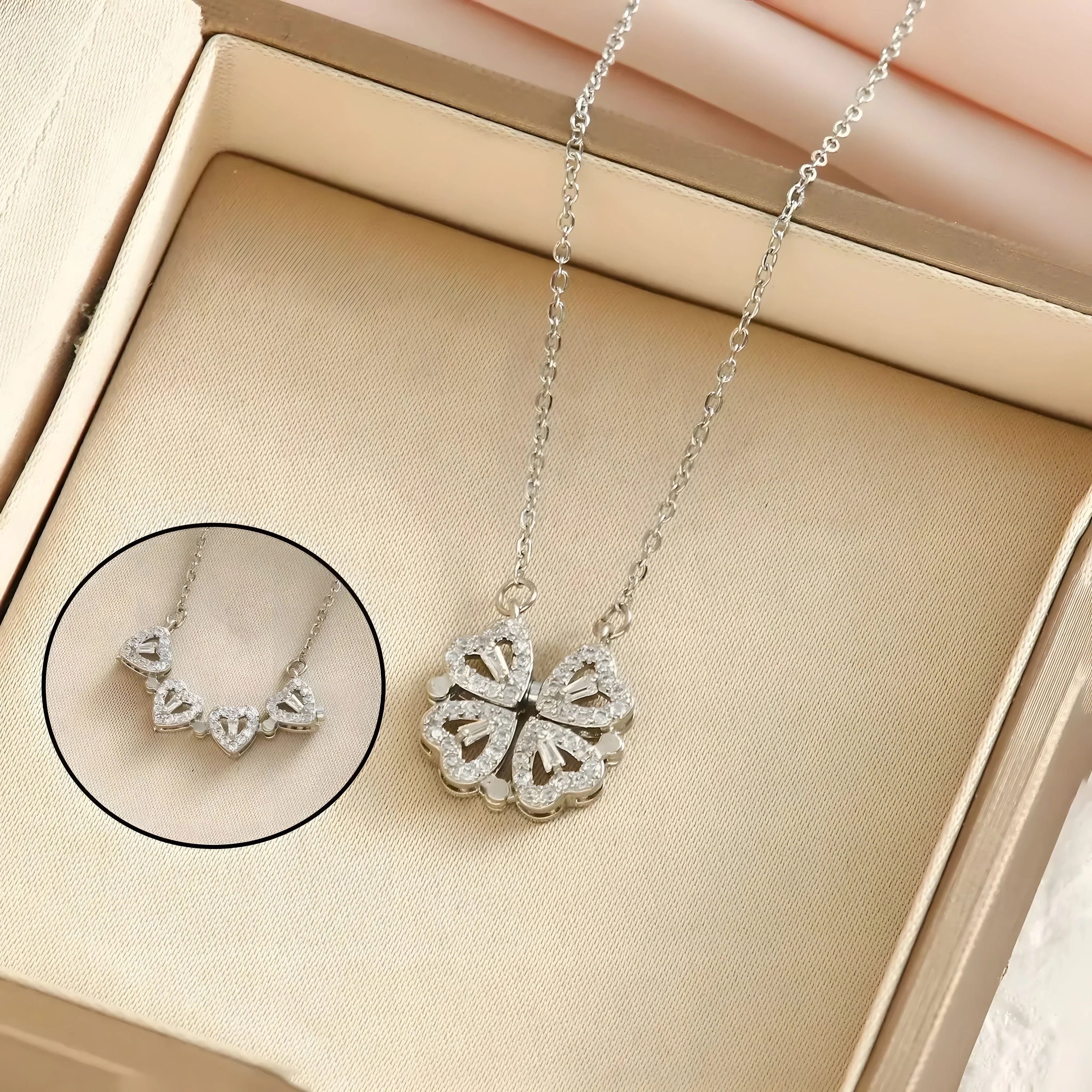 4-in-1 Clover Necklace, silver plated, adjustable pendant with clear crystals, minimalist style.