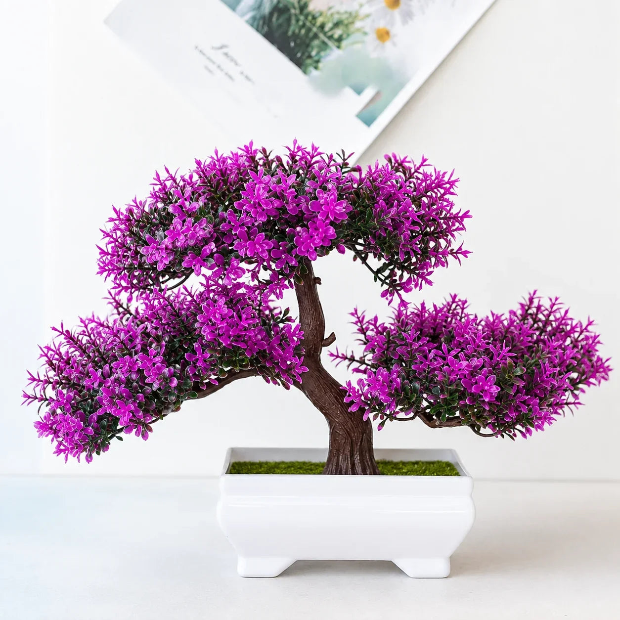 Purple artificial bonsai tree in white ceramic pot for home decor