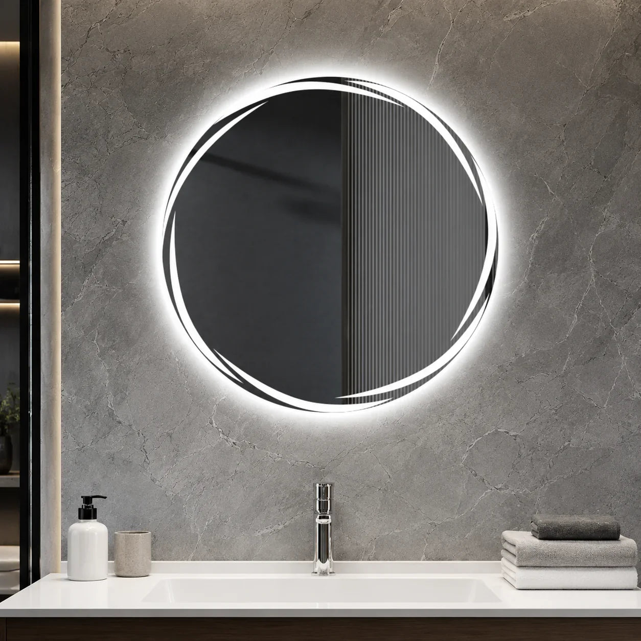 Round LED bathroom mirror with sleek frame, mounted on gray marble wall above modern vanity sink