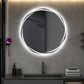 Round LED bathroom mirror with sleek frame, modern lighting for vanity, mounted above sink in contemporary bathroom