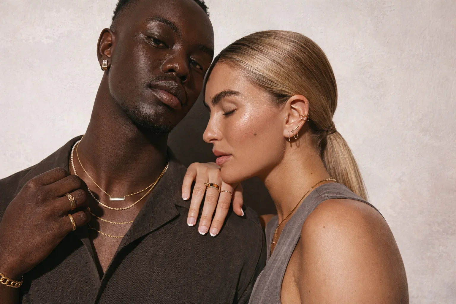 Gold minimalist necklace and rings for everyday elegance, crafted in high-quality materials