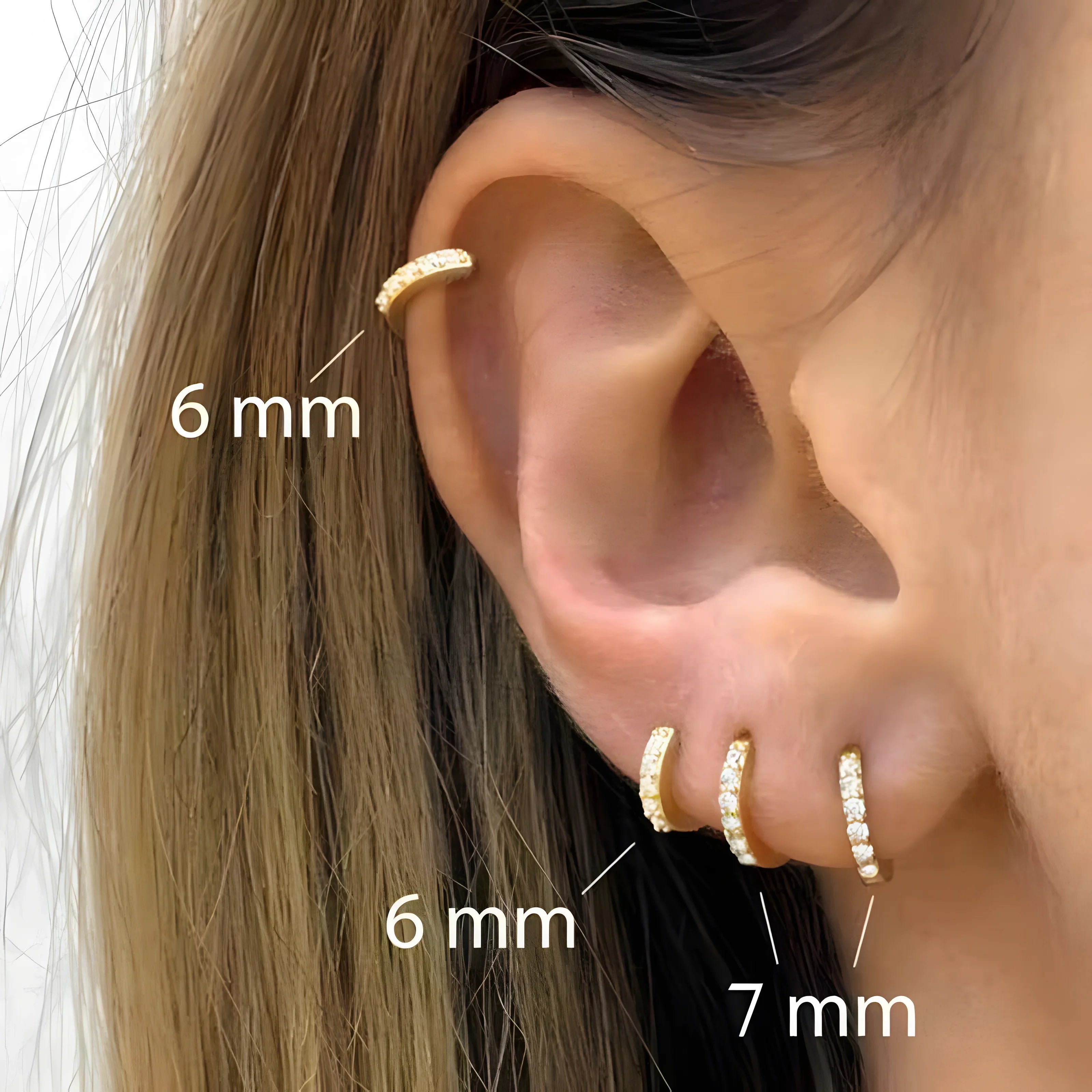 Crystal hoop earrings gold, minimal style, 6mm and 7mm diameter, worn in multiple ear piercings