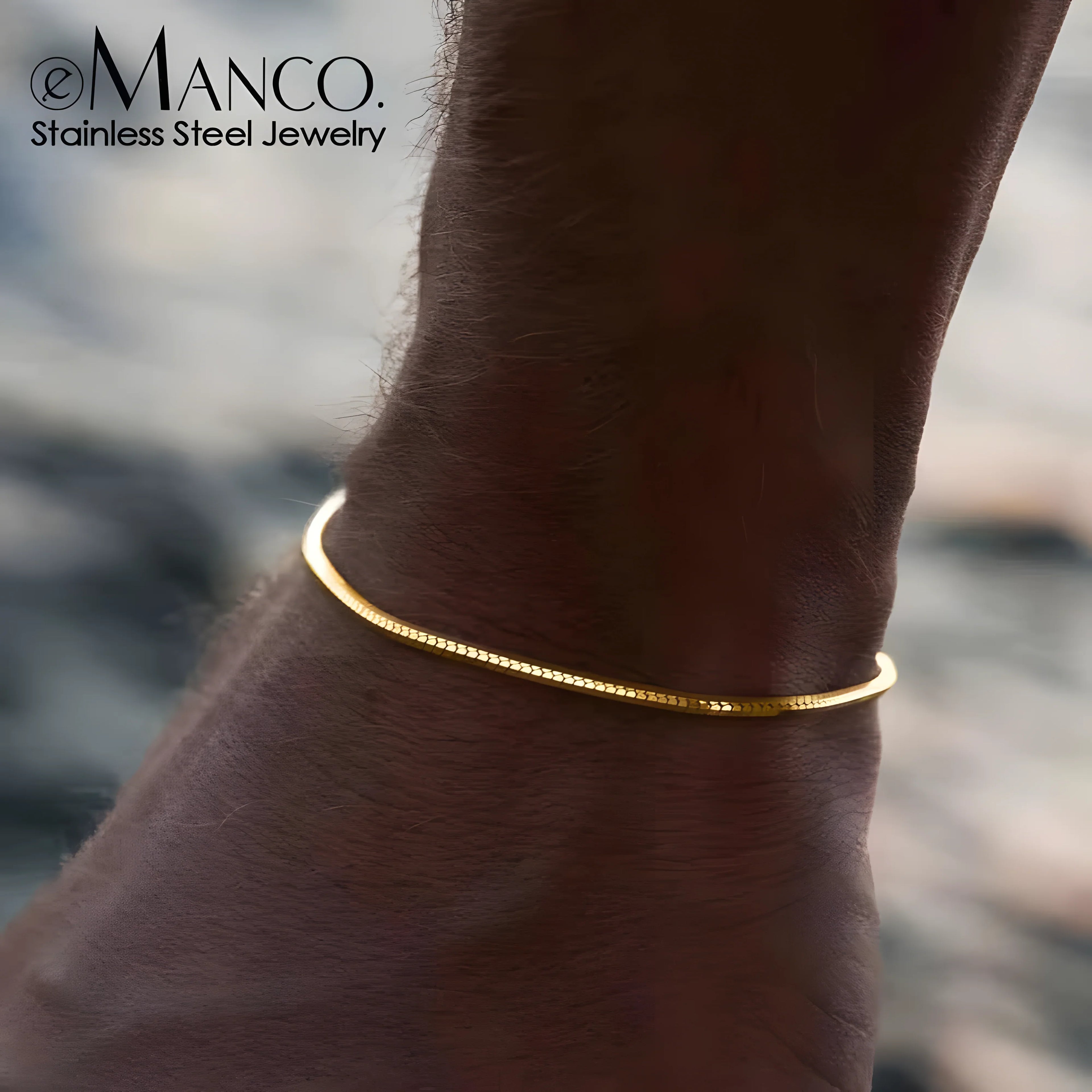 Emanco snake bracelet, gold stainless steel, minimal cuff style on wrist