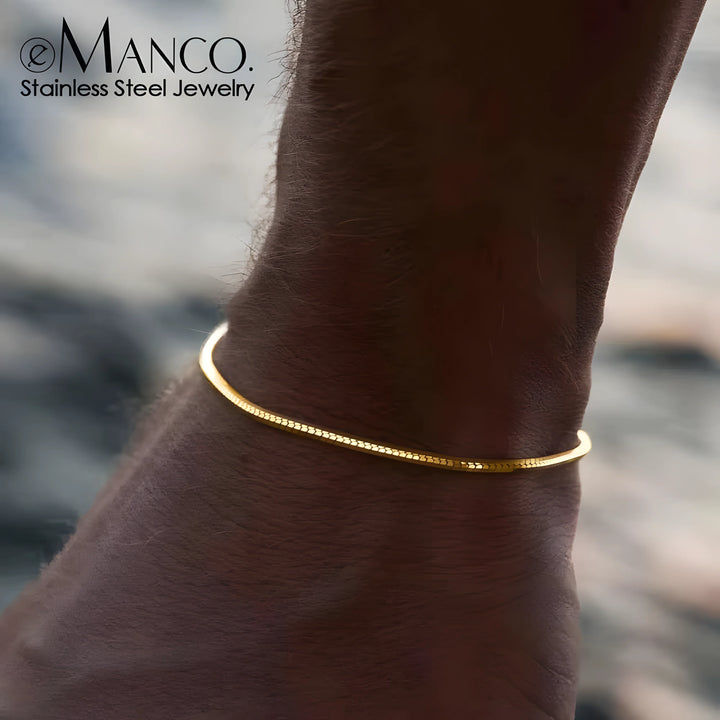 Emanco snake bracelet, gold stainless steel, minimal cuff style on wrist