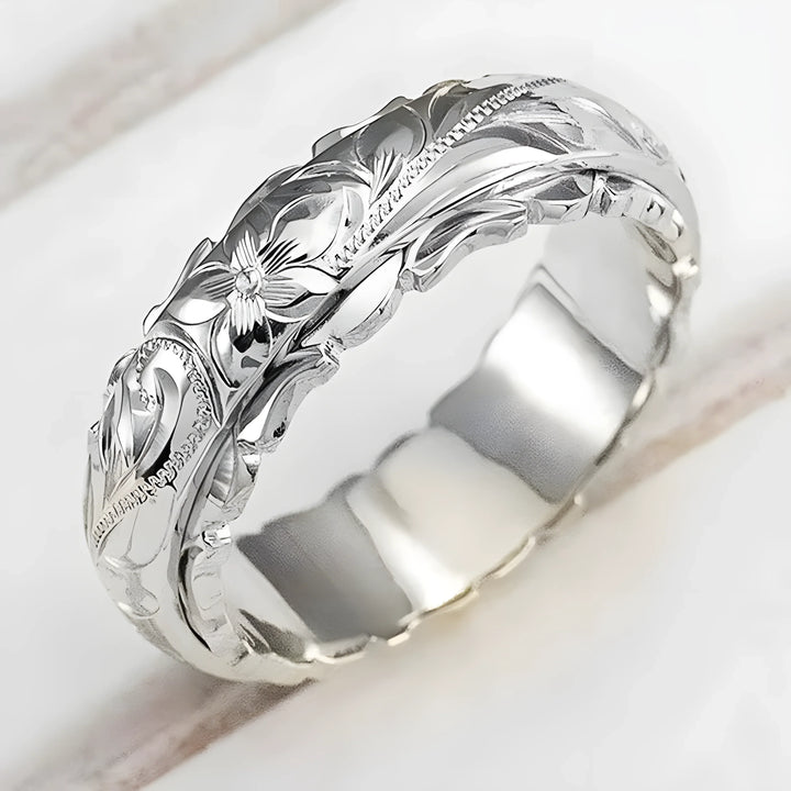 Silver floral engraved ring with intricate leaf design, polished finish, timeless style