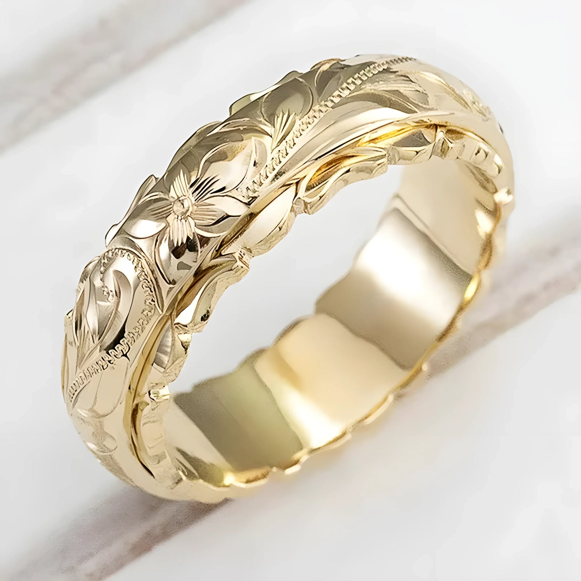 Gold floral engraved ring, elegant design, high-quality material, timeless style
