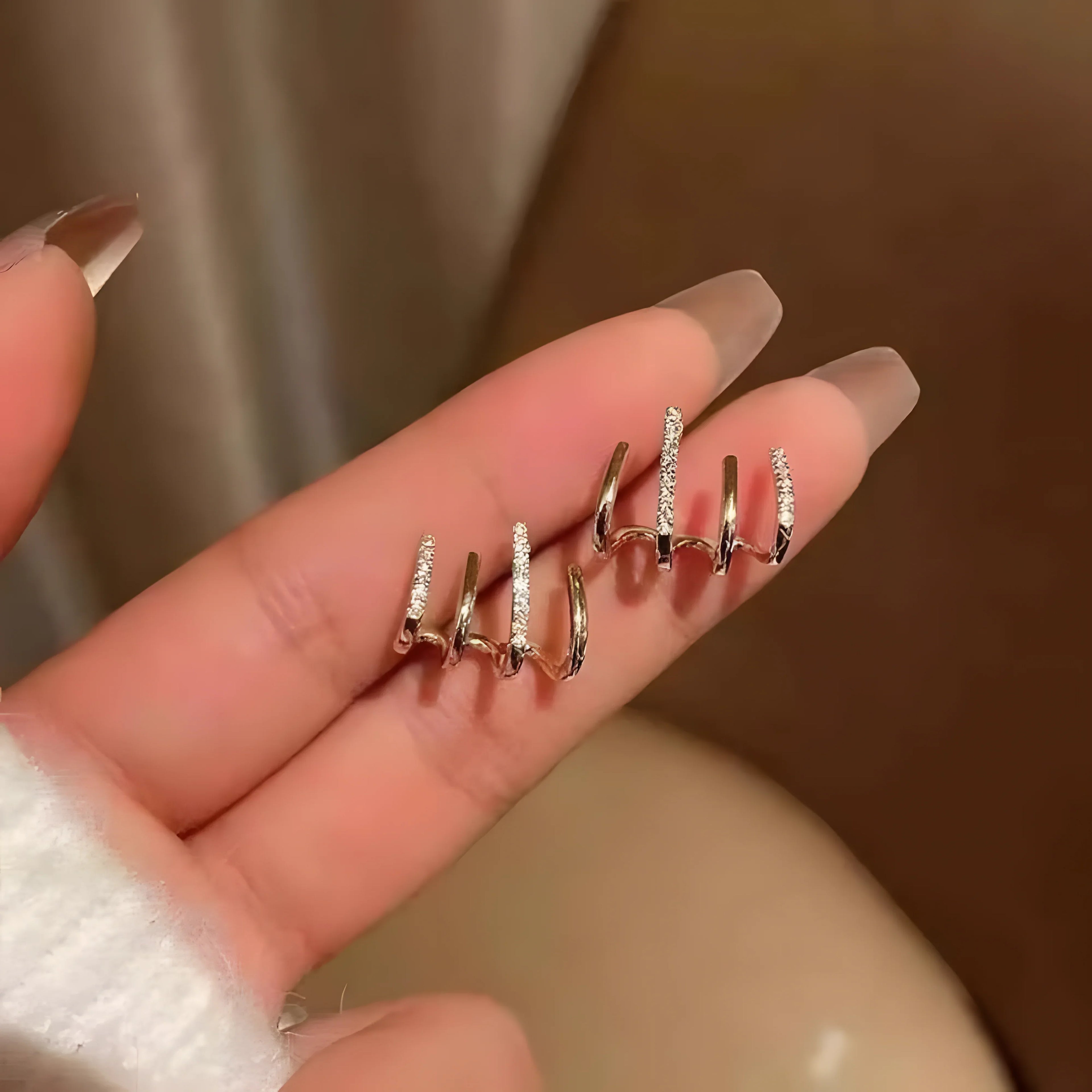 Four claw stud earring set, gold color, minimalist style with clear stones, modern jewelry