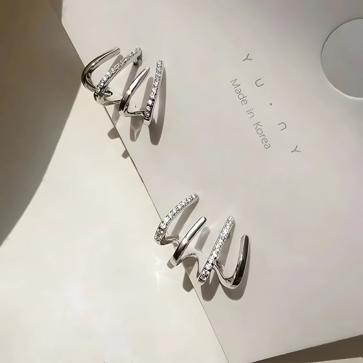 Four-Claw Stud Set silver earrings with cubic zirconia, minimalist spiral style, modern jewelry