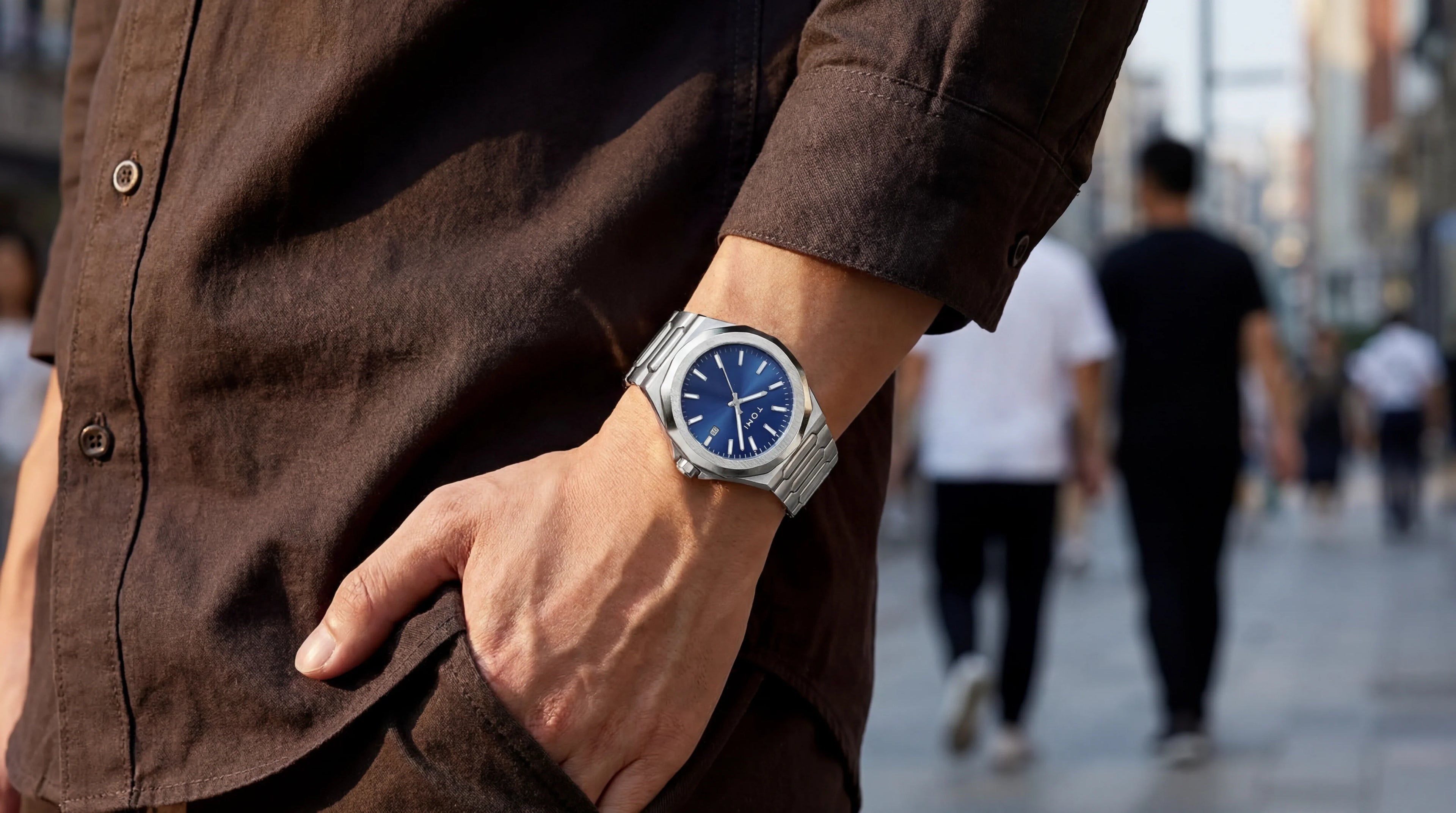 Minimal silver metal wristwatch with blue dial, everyday style jewelry for men