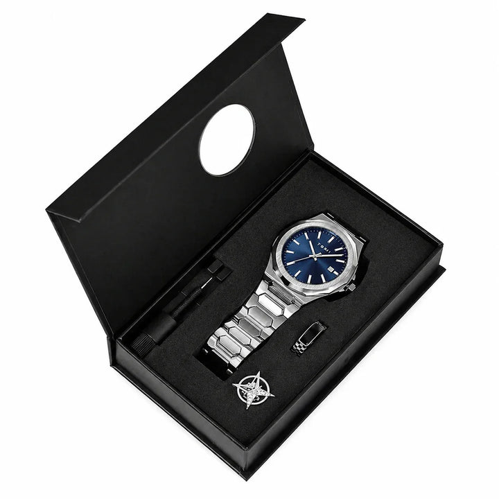 Men's silver stainless steel watch with blue dial, boxed with tool and accessories, modern style.