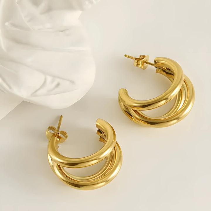Gold triple hoop earrings, minimalist style, polished finish, everyday wear
