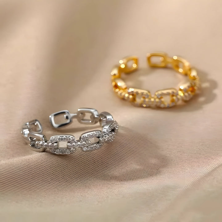 Gold Link Ring, chain style, gold metal, minimal design on beige fabric background
