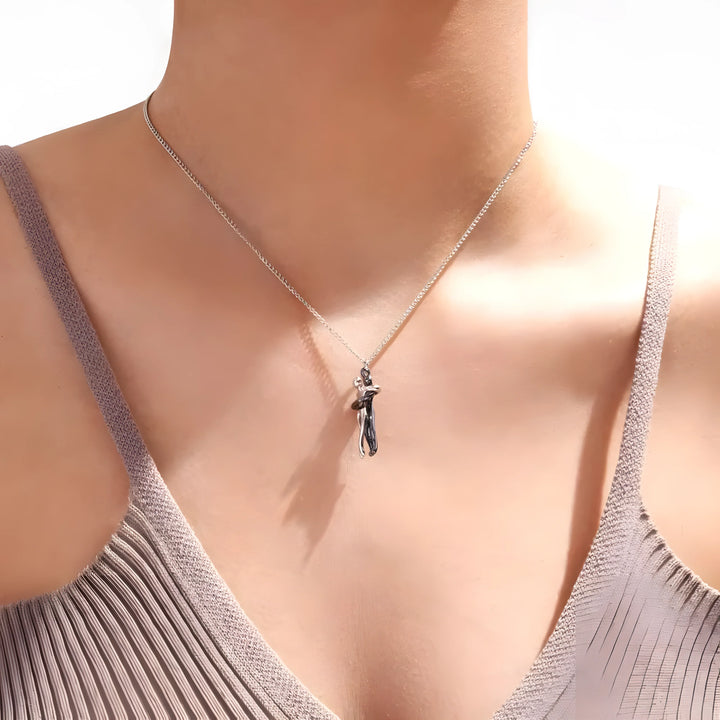 Silver necklace with dancing couple pendant, minimalist design, elegant everyday jewelry