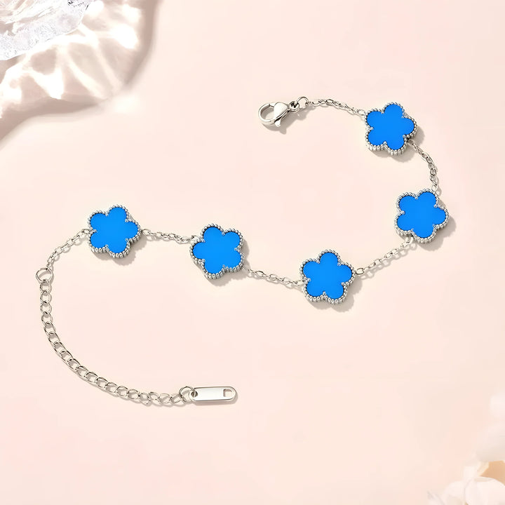 Blue clover charm bracelet in silver, minimalist style with vibrant enamel flowers on delicate chain