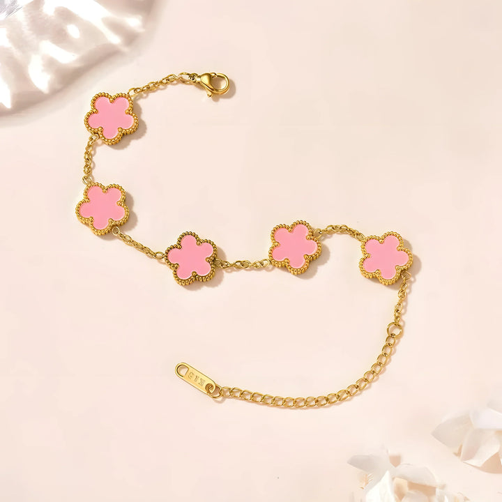 Gold bracelet with pink clover charms, minimalist style, everyday wear