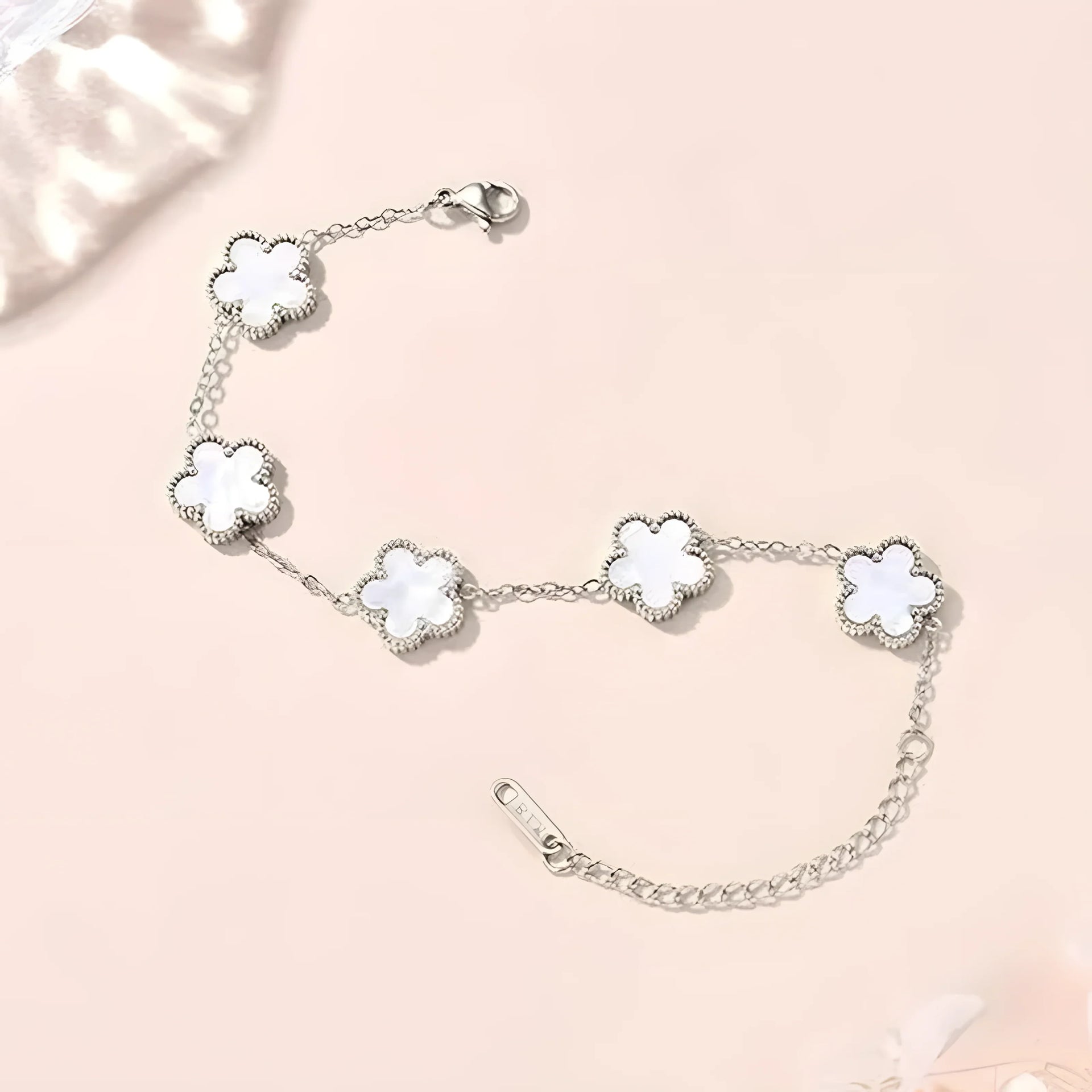 Silver flower bracelet with white mother-of-pearl petals, minimal design for everyday wear