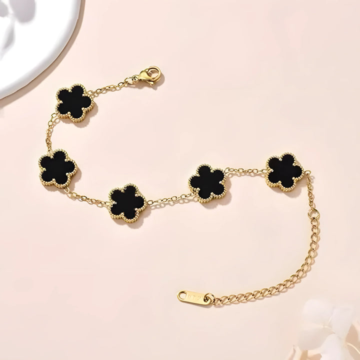 Gold bracelet with black clover charms, minimalist style, everyday elegance