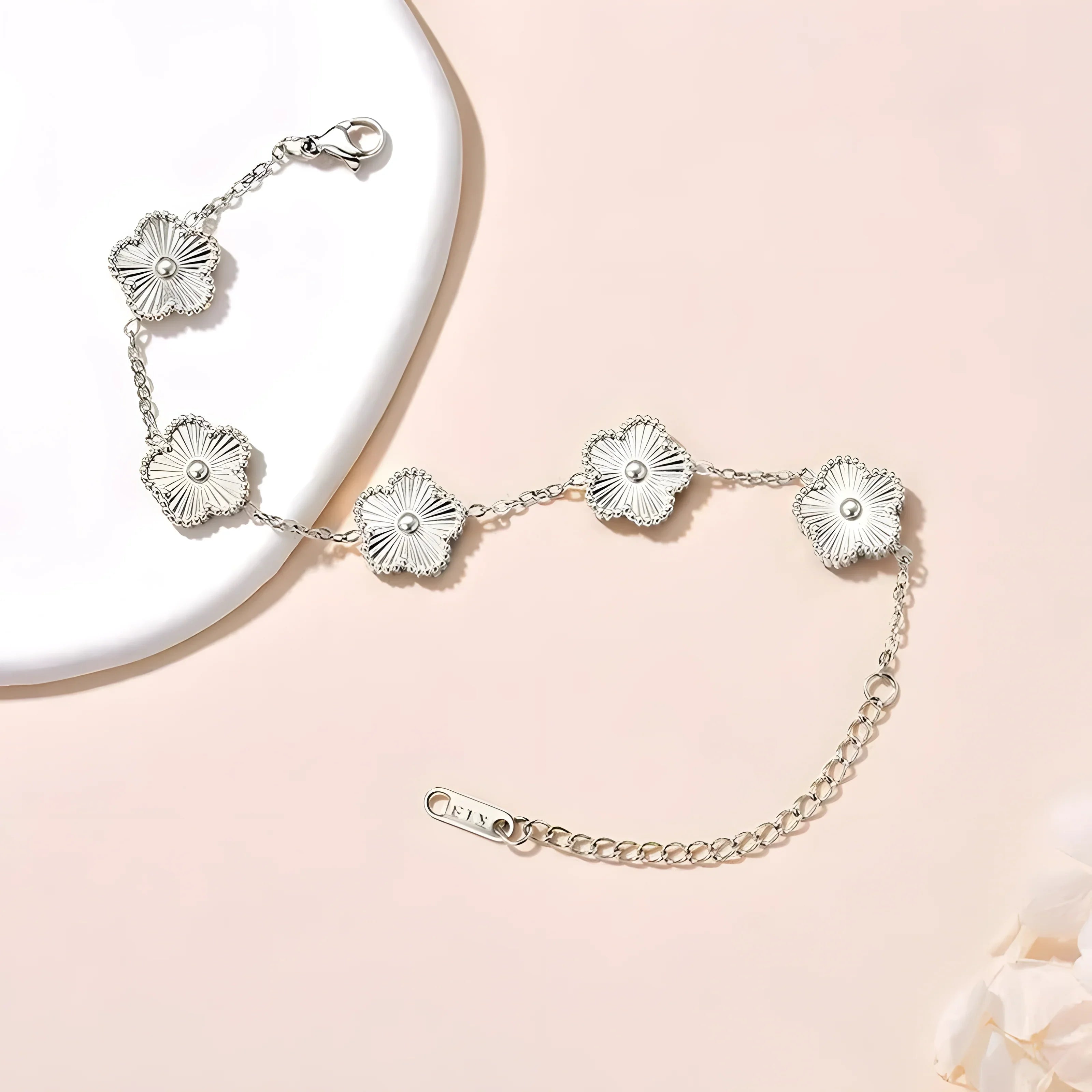 Silver flower bracelet with delicate chain, minimalist design, elegant everyday jewelry
