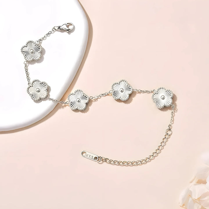 Silver flower bracelet with delicate chain, minimalist design, elegant everyday jewelry