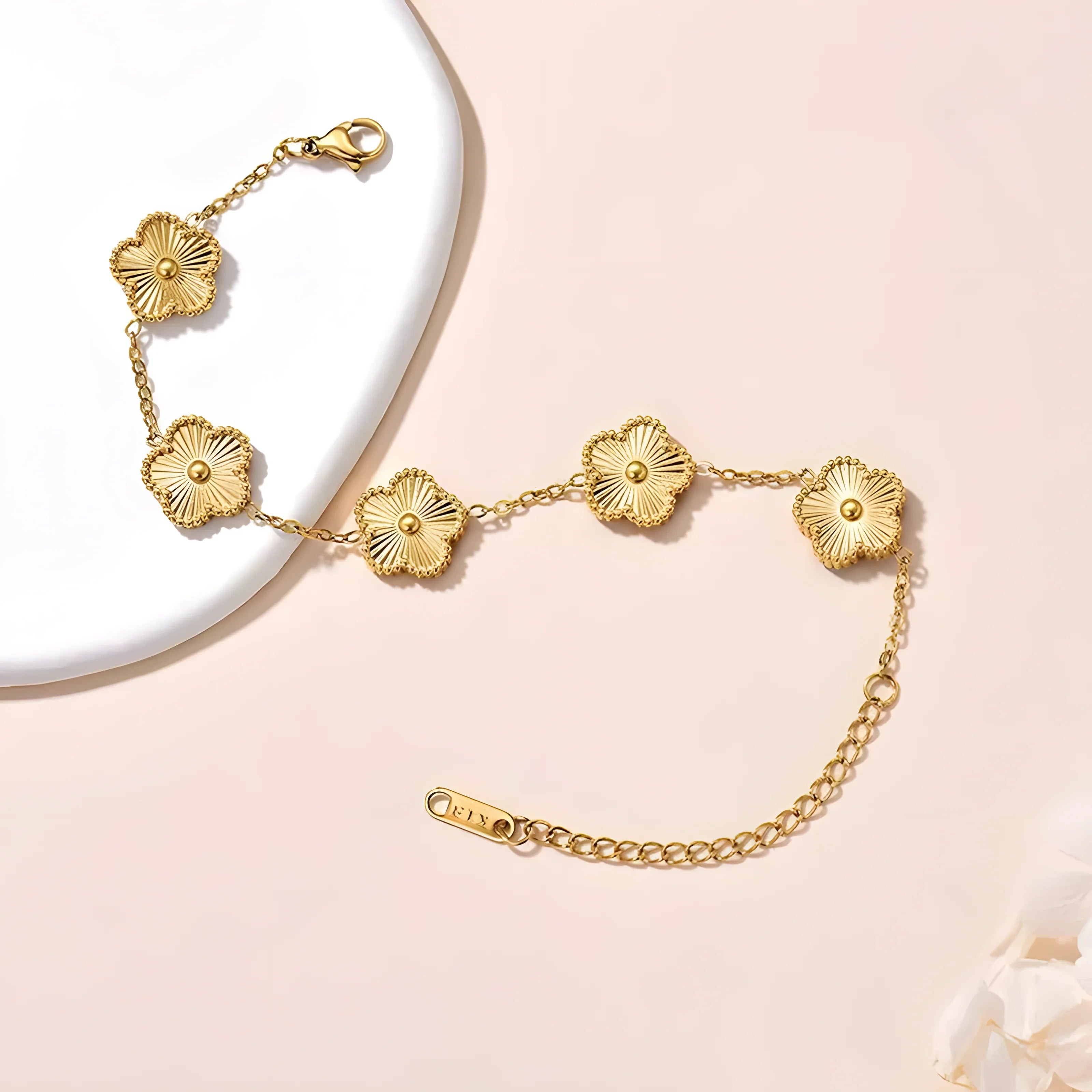Gold flower link bracelet with delicate chain, minimalist design for everyday wear