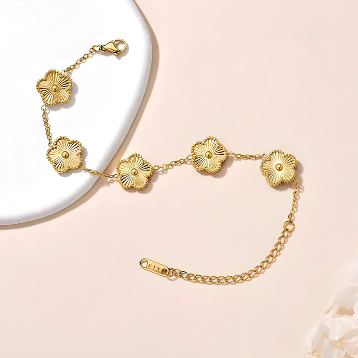 Gold flower link bracelet with delicate chain, minimalist design for everyday wear
