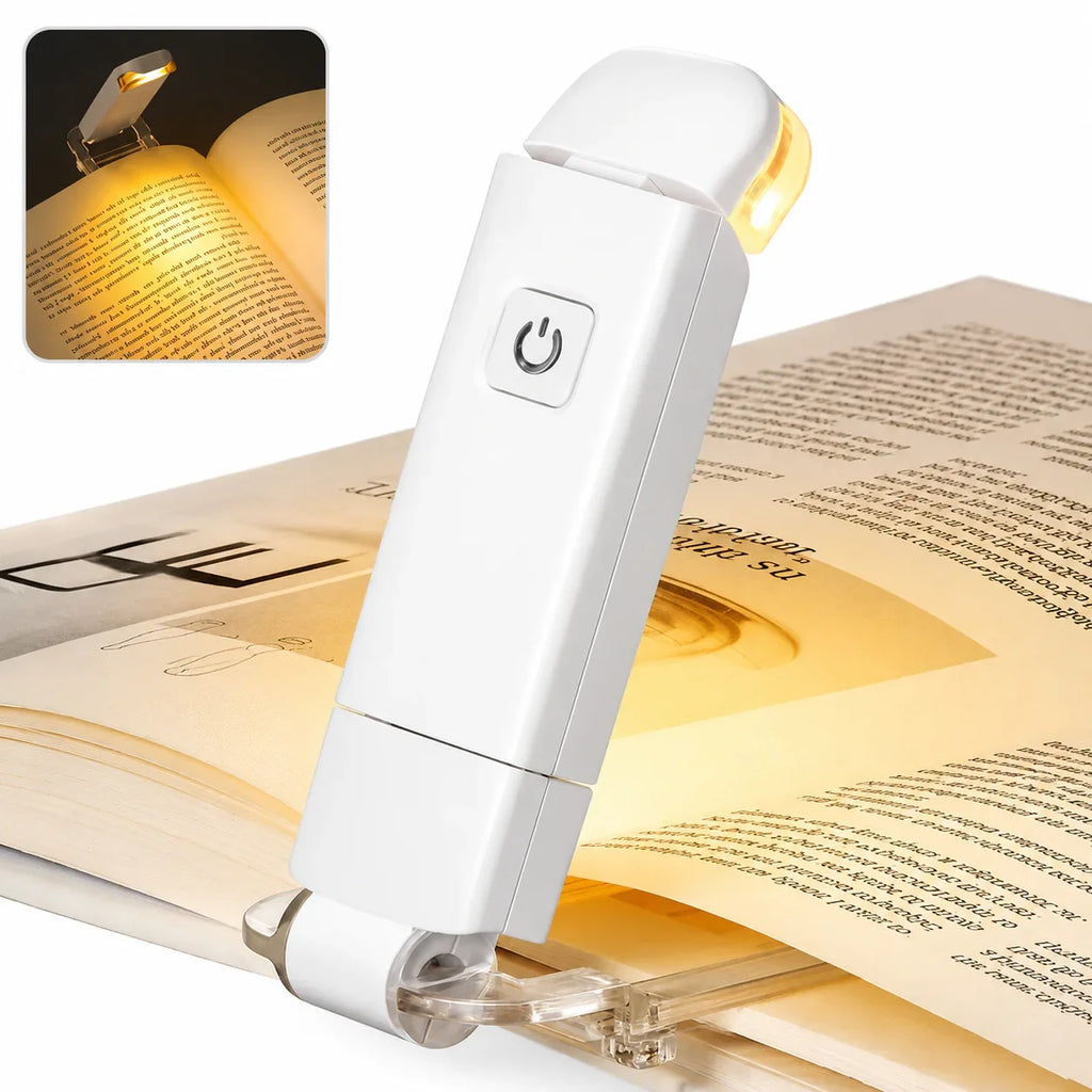 White clip-on book light with warm LED, illuminating pages for reading
