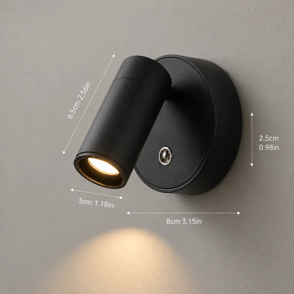 Black matte wall sconce with adjustable cylindrical light head, modern minimalist design for home lighting