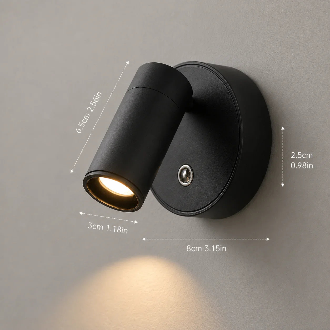 Black matte wall sconce with adjustable cylindrical light head, modern minimalist design for home lighting