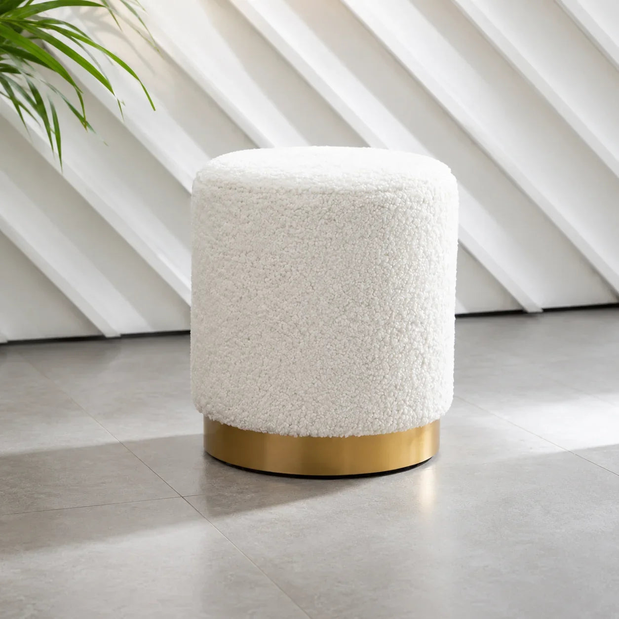 White fluffy round ottoman with gold metal base for living room or bedroom seating