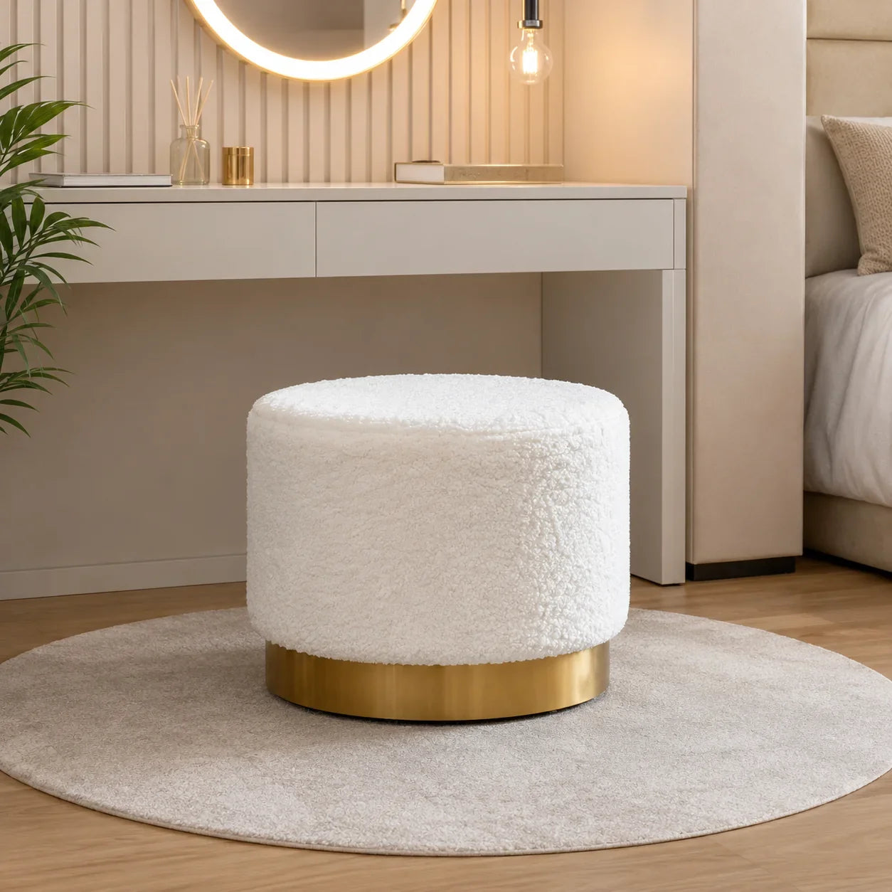 White fluffy round ottoman with gold base for bedroom or vanity seating