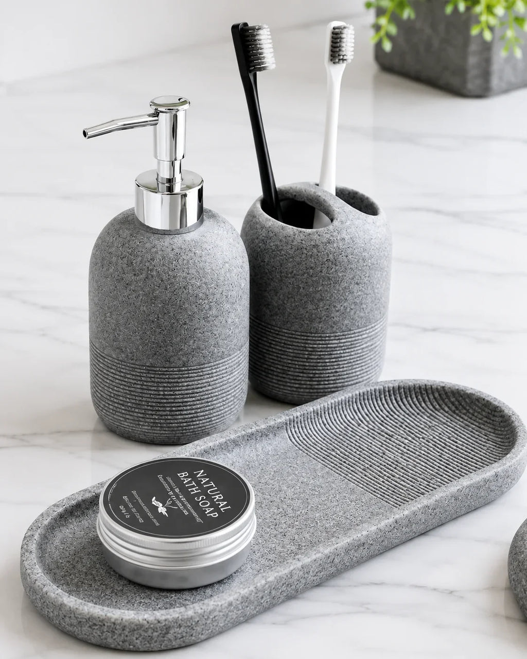 Gray textured bathroom set with soap dispenser, toothbrush holder, and soap tray for modern home organization