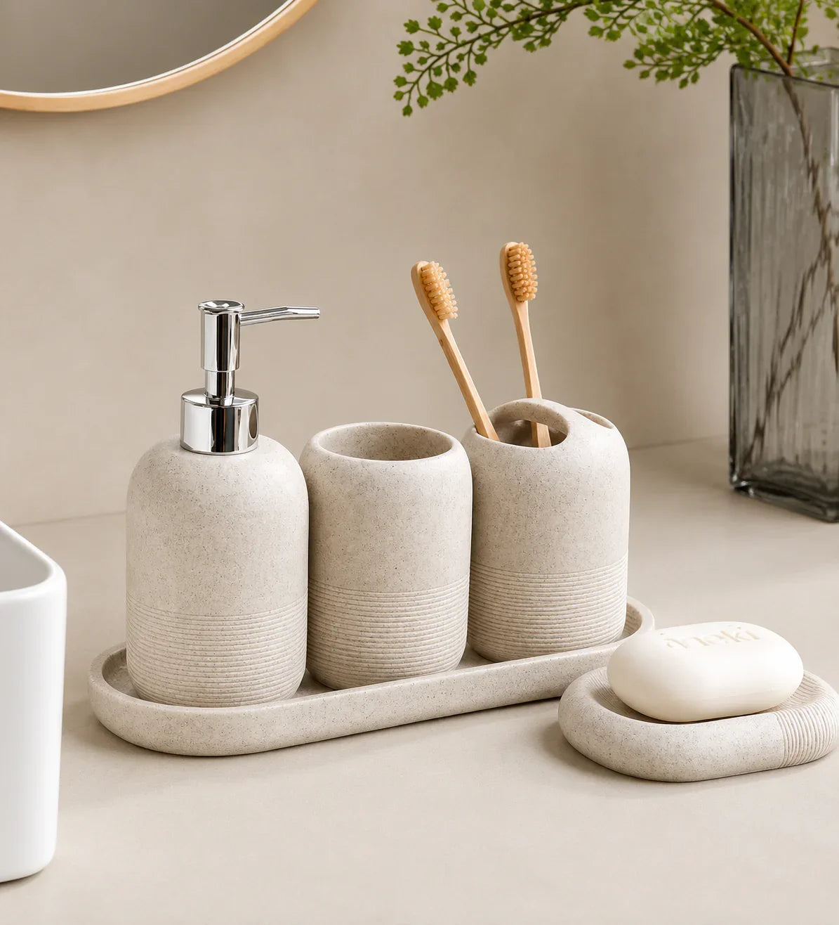 Beige ceramic bathroom set with soap dispenser, toothbrush holders, and soap dish for modern organization