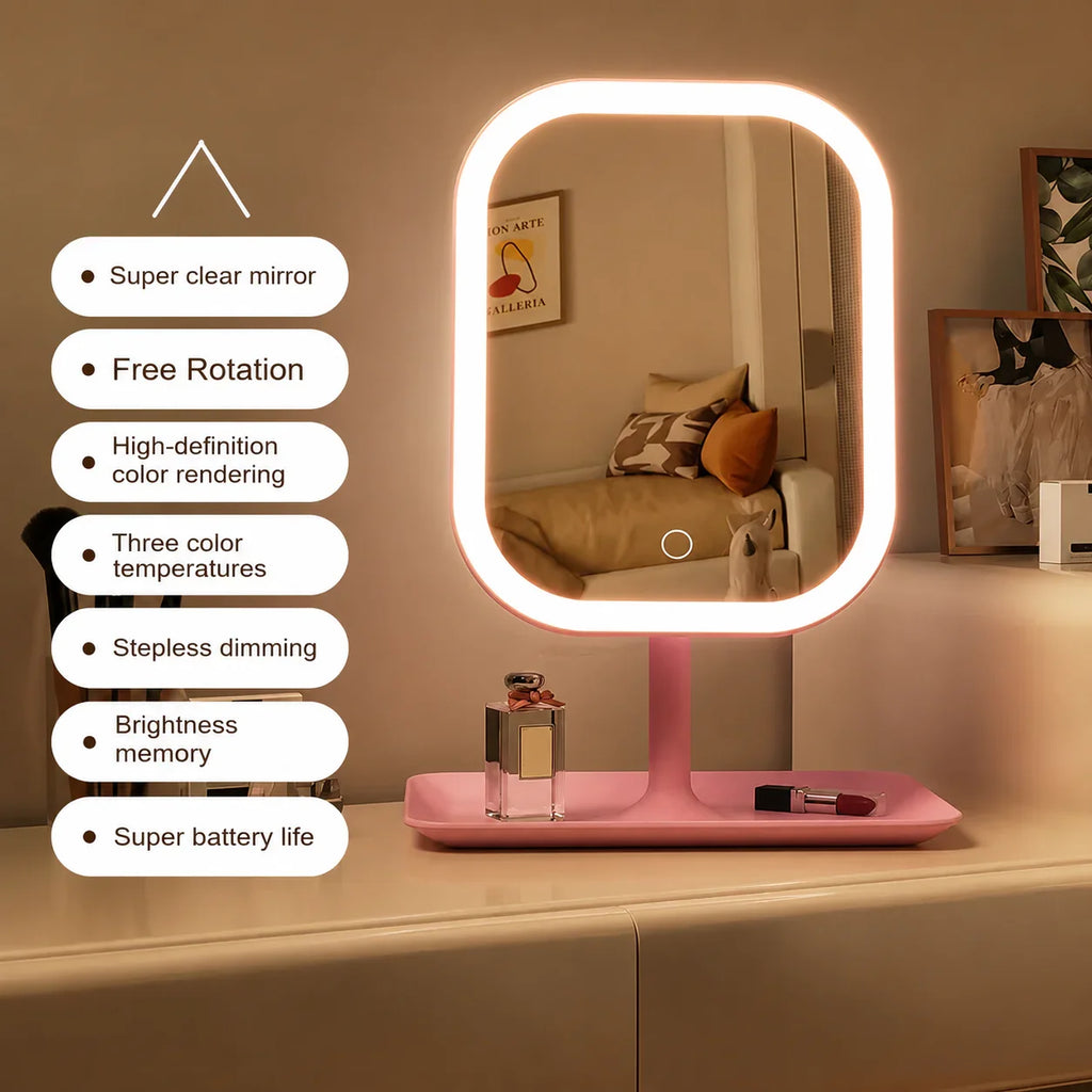 Pink LED vanity mirror with adjustable lighting and storage tray for bathroom or bedroom use