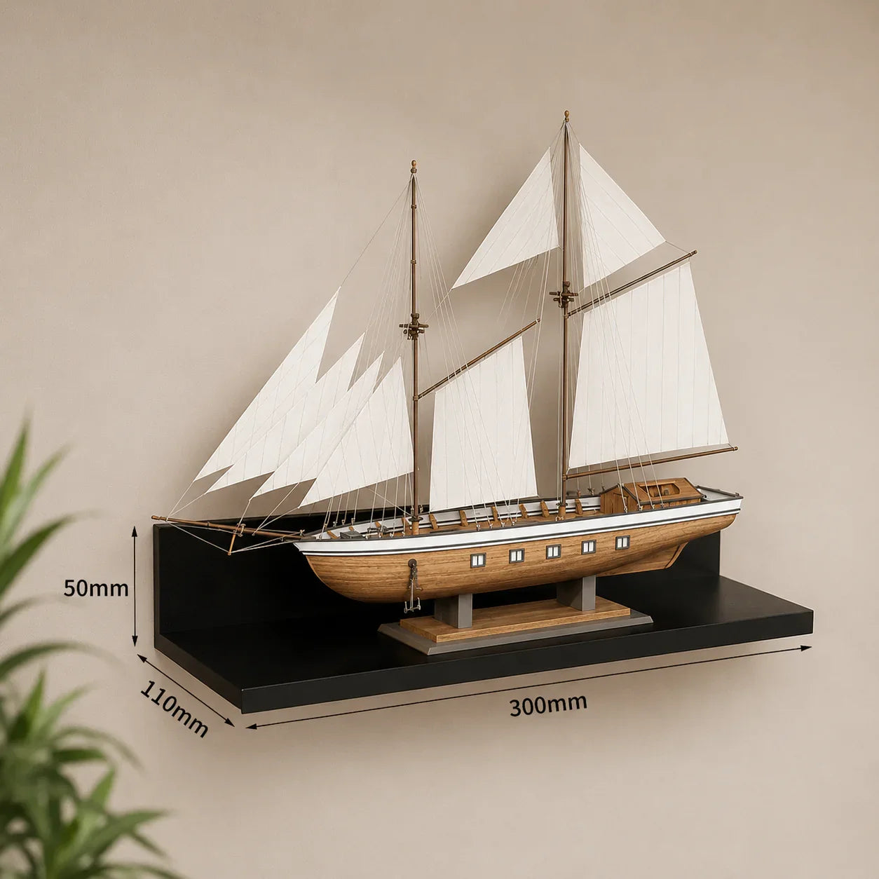 Wooden sailboat model with white sails on black shelf, home décor accent