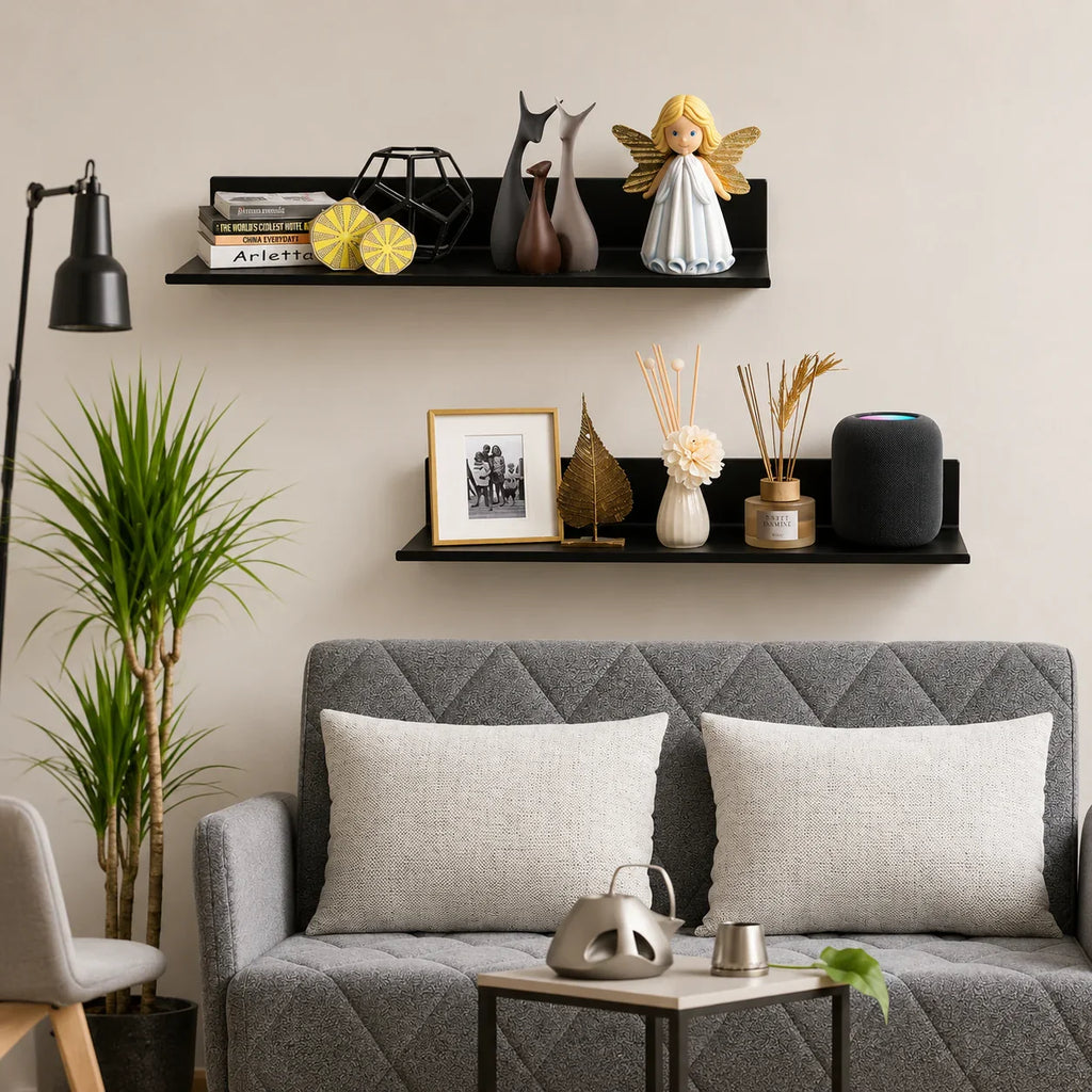 Black floating shelves displaying decor, books, and angel figurine in modern living room