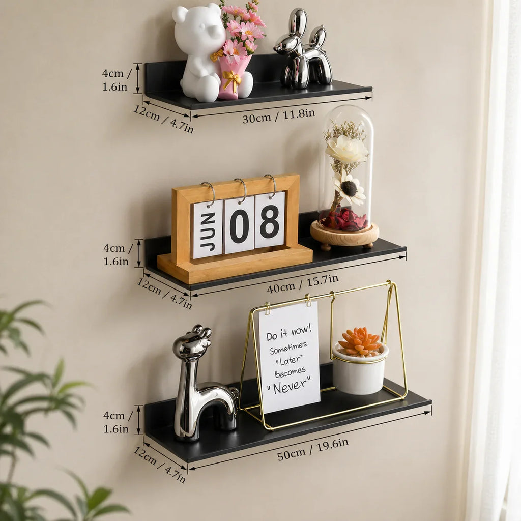 Black floating wall shelves with decorative items for home organization and styling