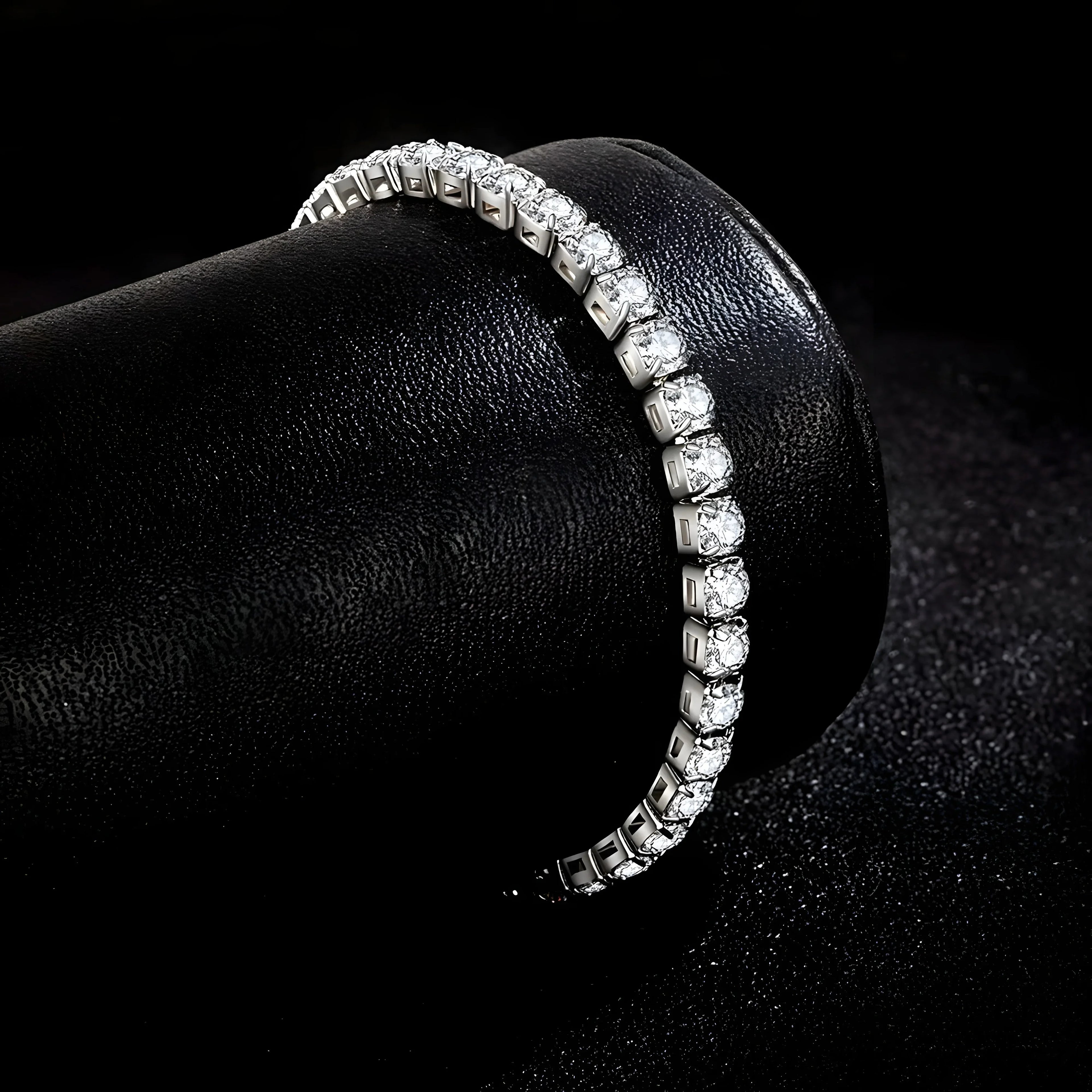 Elegant silver tennis bracelet with clear crystals, minimalist design on black velvet display