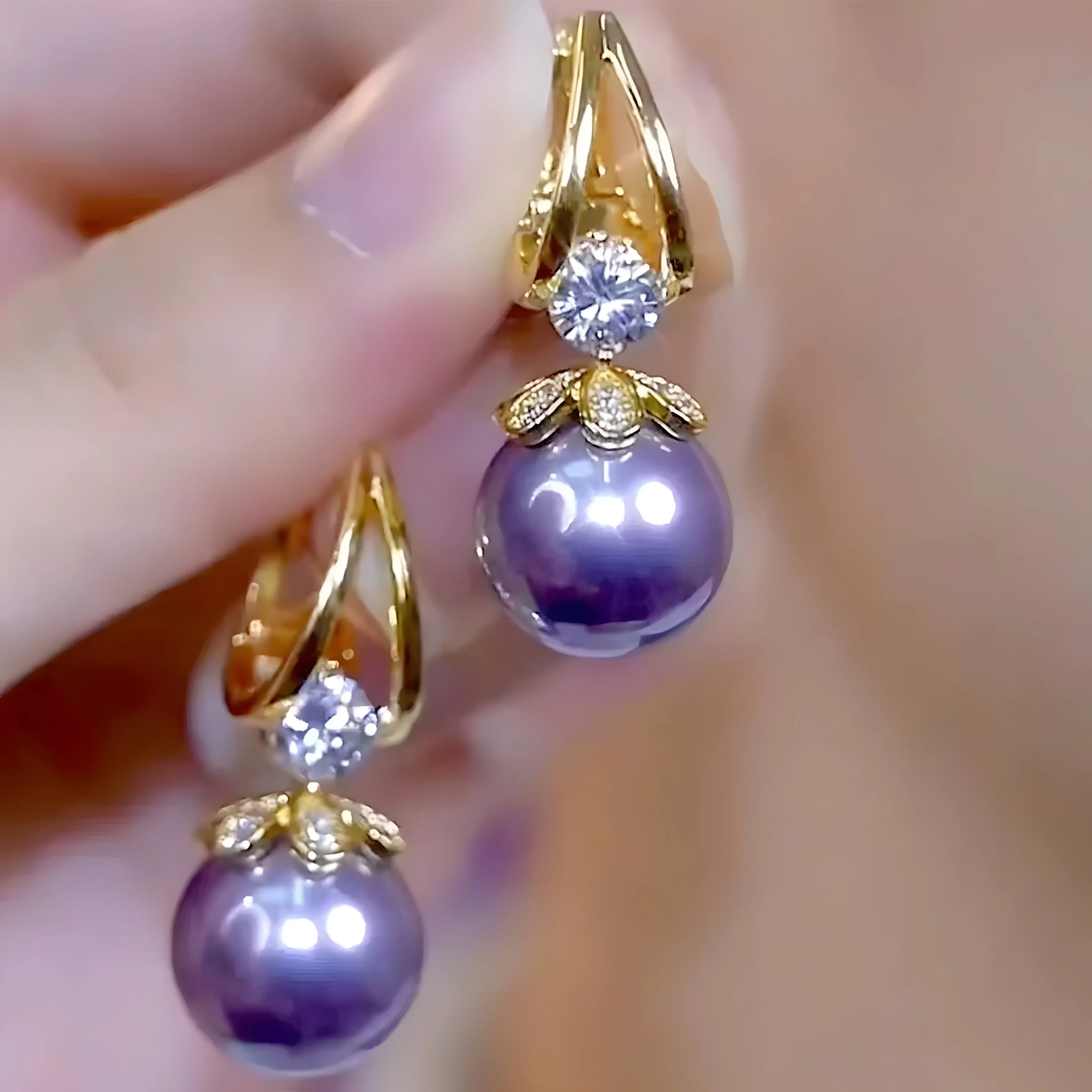 Purple pearl drop earrings with gold setting and diamond accents, elegant dangle style