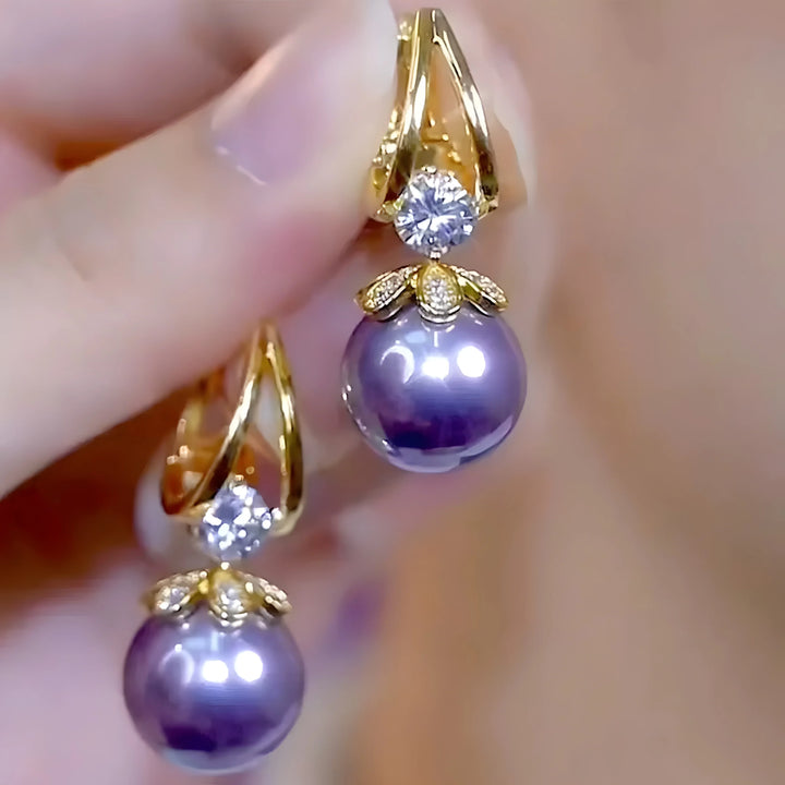 Purple pearl drop earrings with gold setting and diamond accents, elegant dangle style