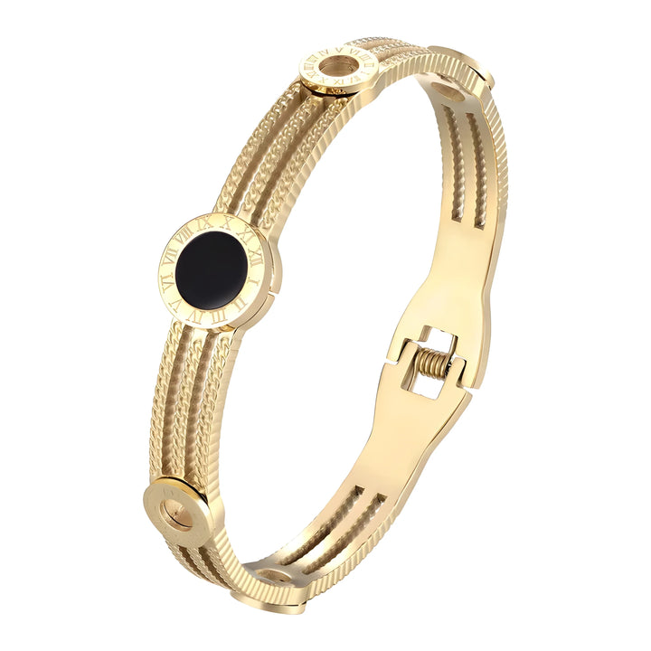 Gold-tone bangle bracelet with Roman numeral bezel, black dial, and textured band, minimalist luxury style