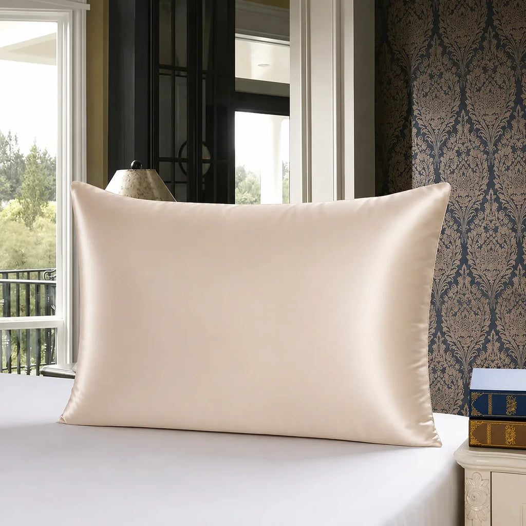 Cream satin pillowcase on white bed, luxury bedroom decor with patterned wallpaper and window view