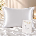 White satin pillowcase on bed with moon card, for luxury bedroom sleep comfort