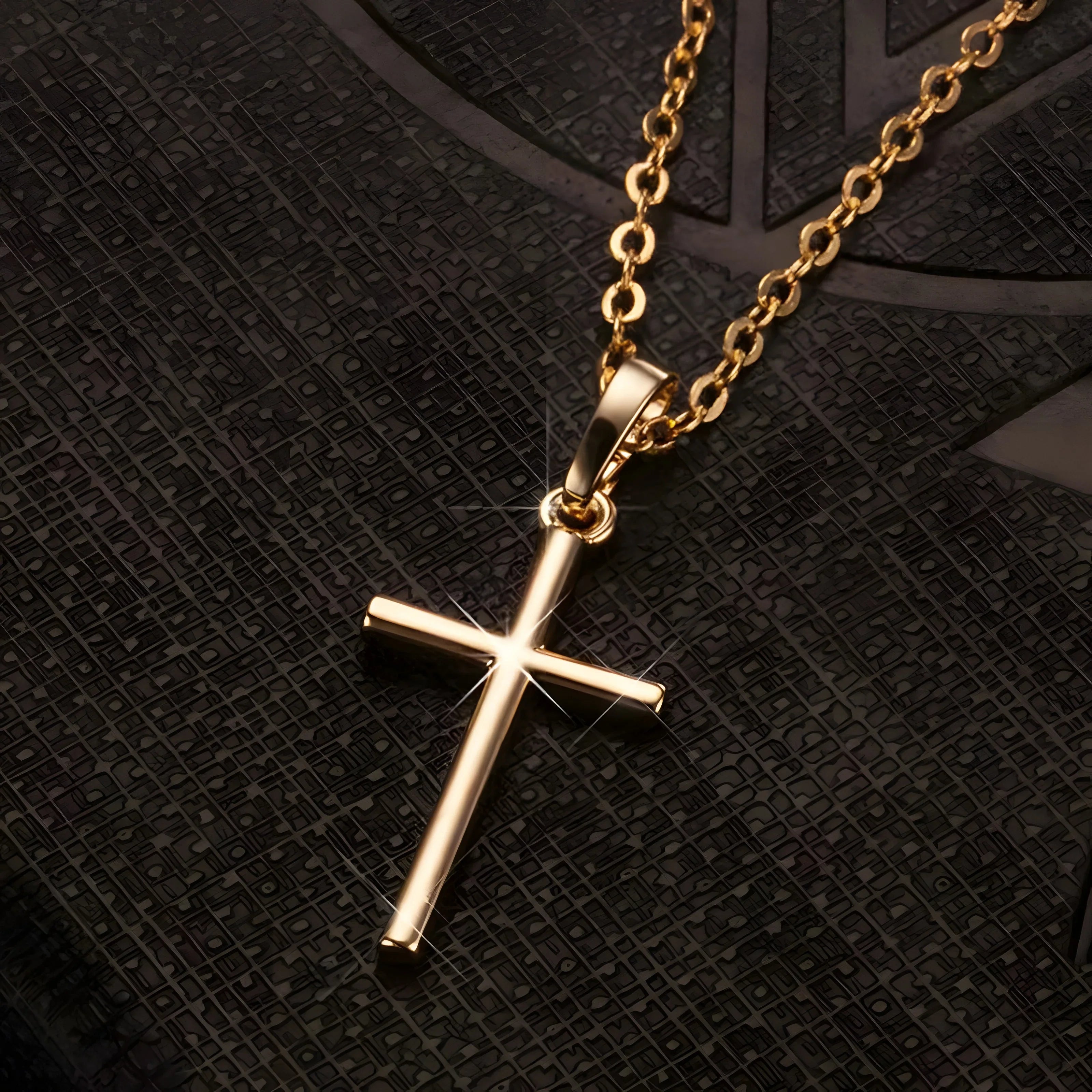 Gold cross pendant necklace with minimalist design on textured black background