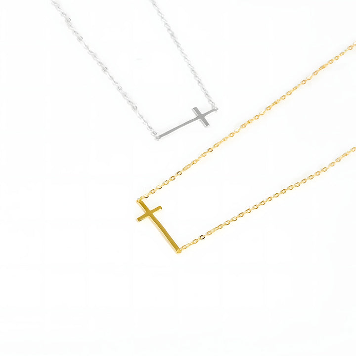 Sterling silver and gold cross necklaces, minimal style, horizontal bar pendant, on white background.