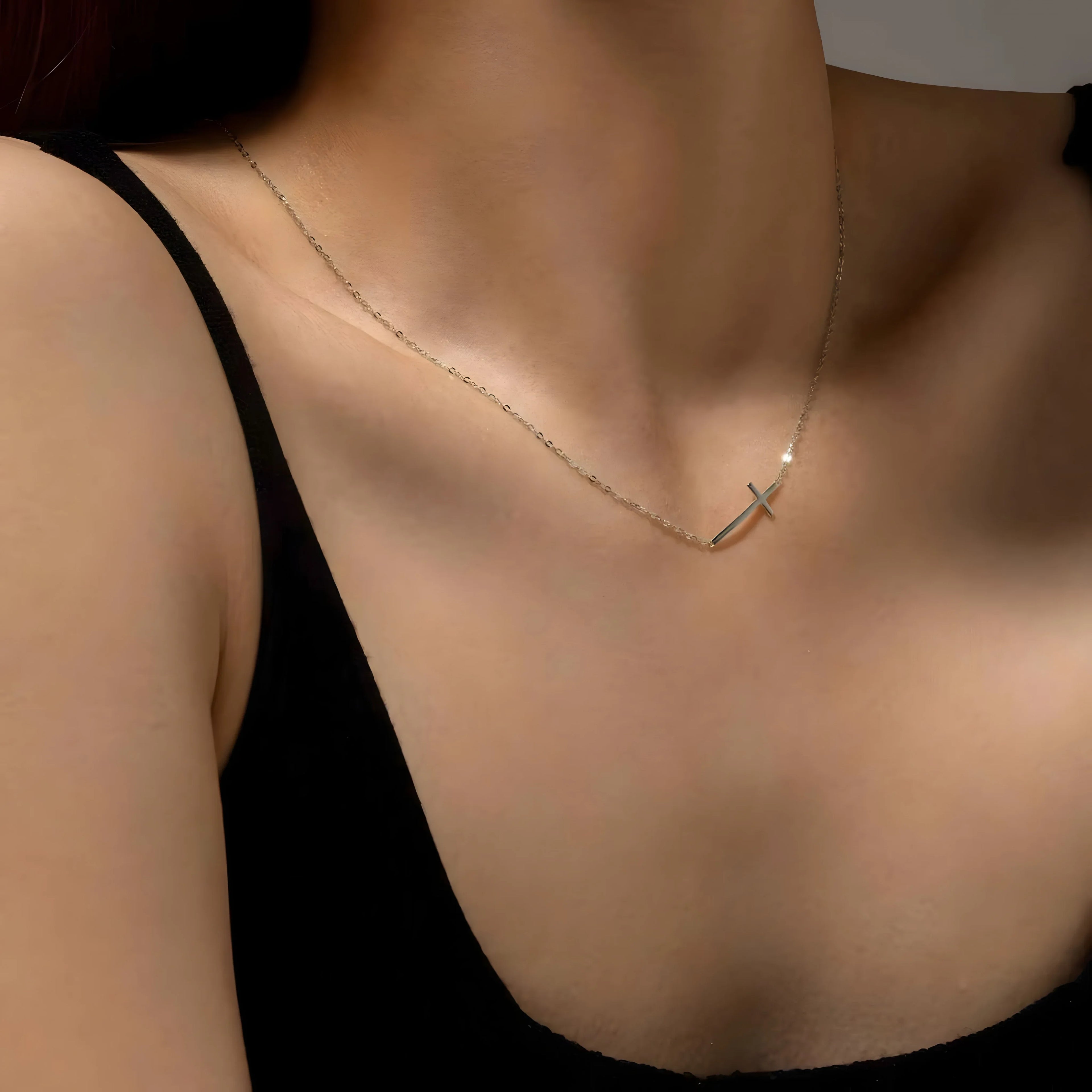 Sterling silver cross necklace, minimal style, delicate chain, silver color, worn on neck