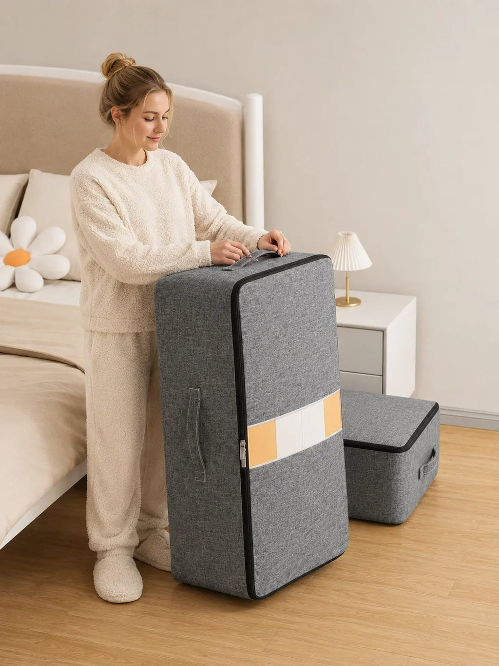 Gray fabric storage box with zipper and handles, used for bedroom organization, featuring yellow and white stripe design.