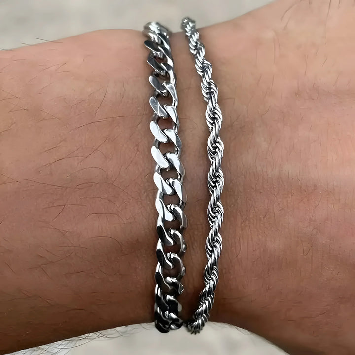 Silver chain bracelets: chunky curb and twisted rope styles on wrist, minimalist men's jewelry