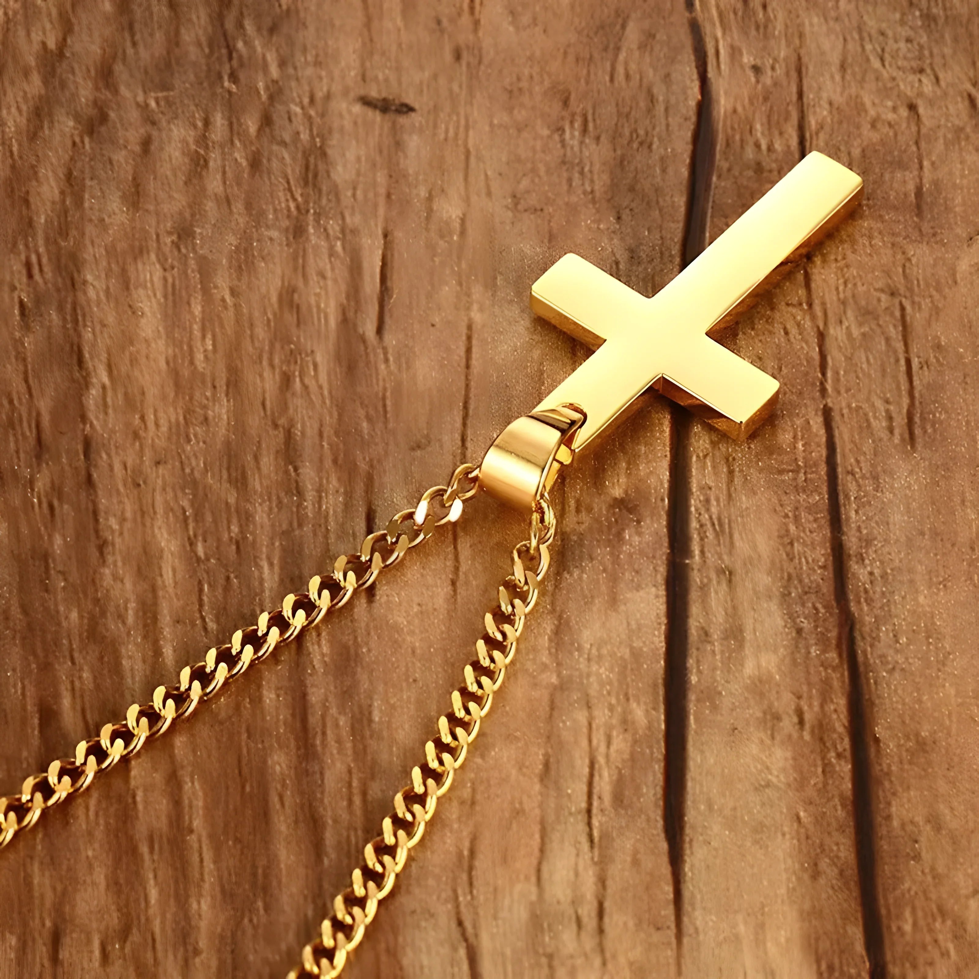 Titan Cross Necklace gold stainless steel minimalist cross pendant chain on wood background