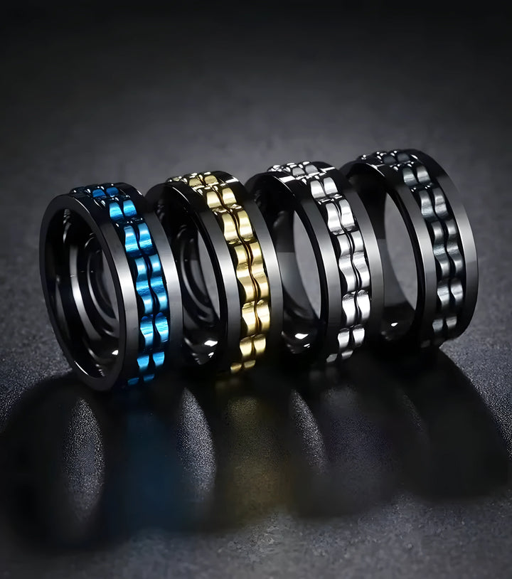 Minimalist titanium rings in blue, gold, silver, and black with textured design for everyday wear