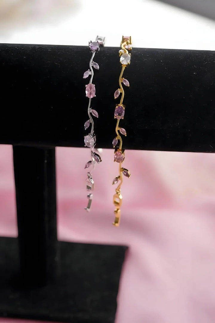 Delicate vine-style bracelet with pink gemstones, gold and silver tone, minimal design for everyday wear
